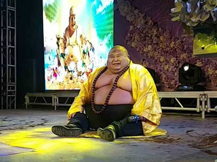Chinese Man Makes a Living Posing as RealLife "Laughing Buddha"