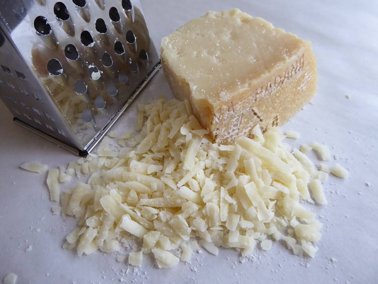 Students mix foot shavings with grated cheese